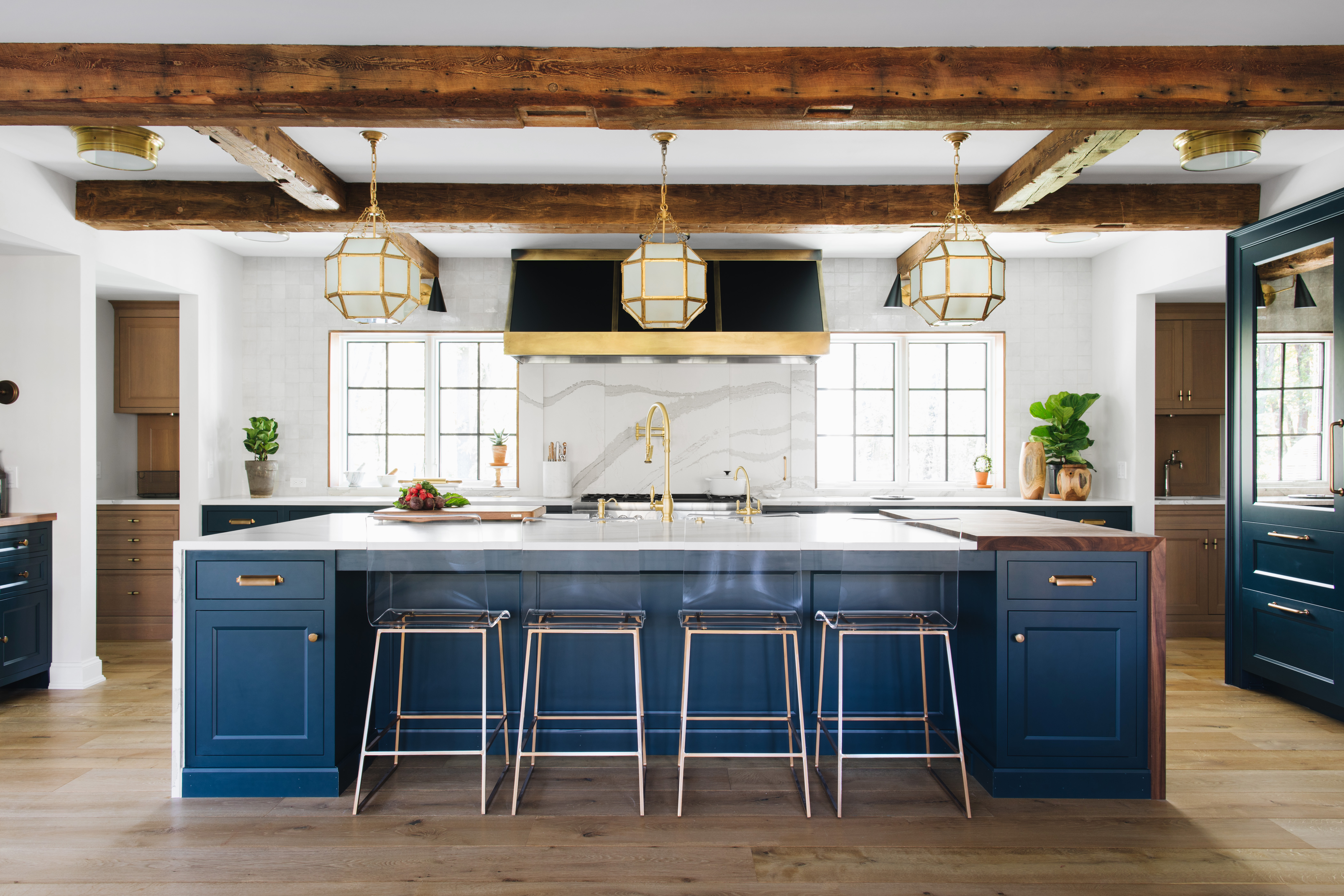 Transitional White Kitchen With Light Blue Cabinets and Brass